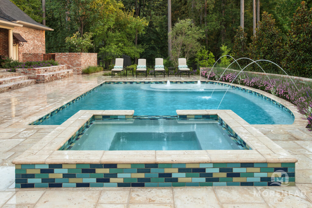 Swimming pool with tanning ledge, home spa and water features