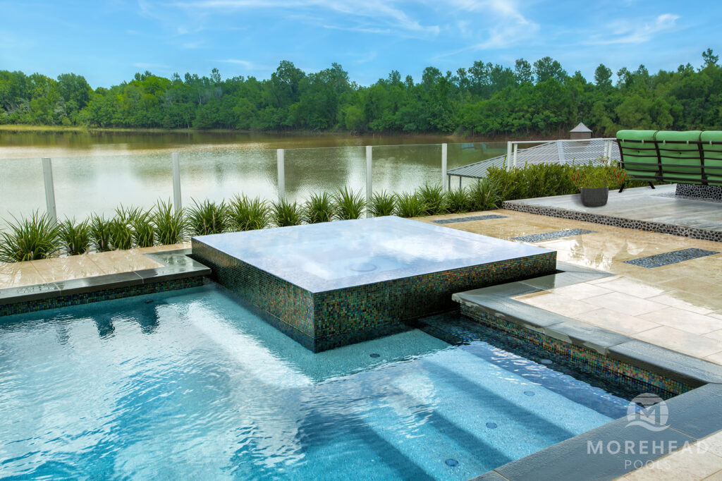 Geometric swimming pool with custom home spa