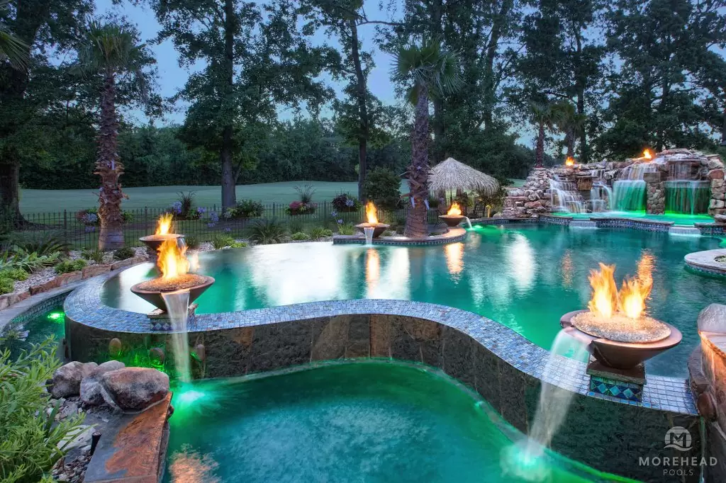 Luxury swimming pool with water features and fire features
