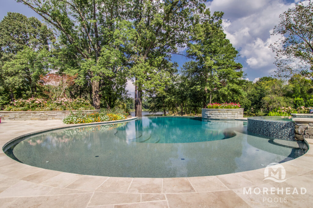 Luxury pool in backyard on summers day