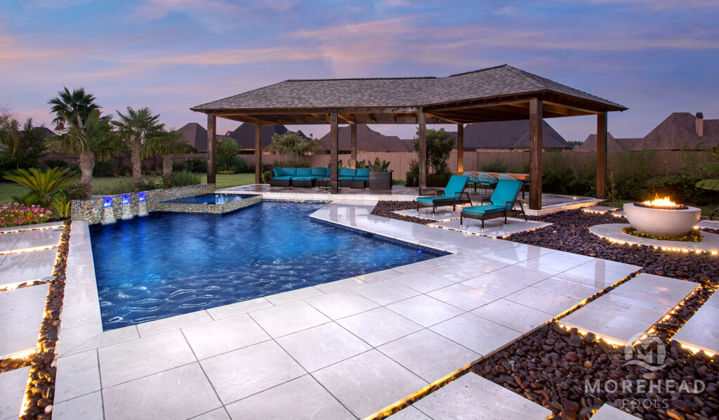 Luxury outdoor living space with pool, fire feature and cover