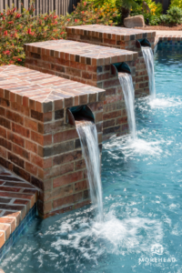 Water fountain ideas for backyard swimming pools